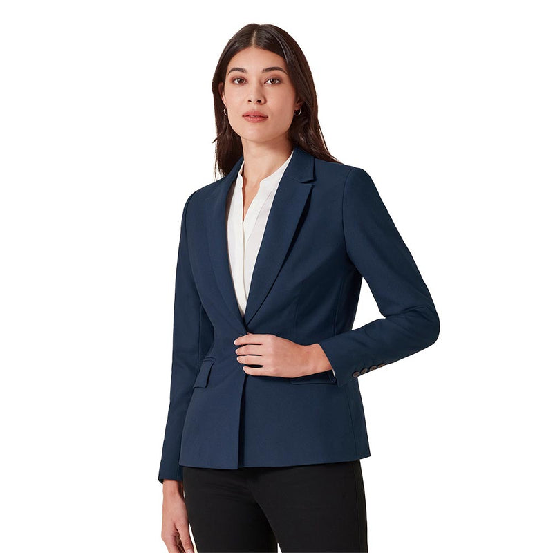 Load image into Gallery viewer, Biz Womens Renew Single Button Mid Length Jacket displayed on a woman adjusting its front, highlighting its structured lapels and sleek, tailored fit designed for versatility and easy care.
