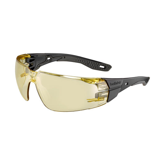 Bolle Rush+ 2.0 Black/Grey Frame Safety Glasses with amber lens, featuring wraparound design, black temples, and ergonomic hinges. Designed for optimal vision and comfort in demanding work environments.