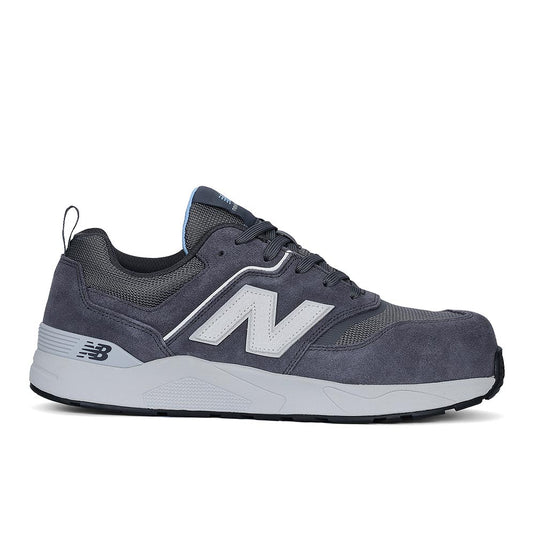 New Balance Elite Lite Womens Safety Shoe, Magnet/Whispy Blue, features a gray suede and mesh design with a large “N” logo, composite toe, cushioned midsole, and slip-resistant rubber outsole.