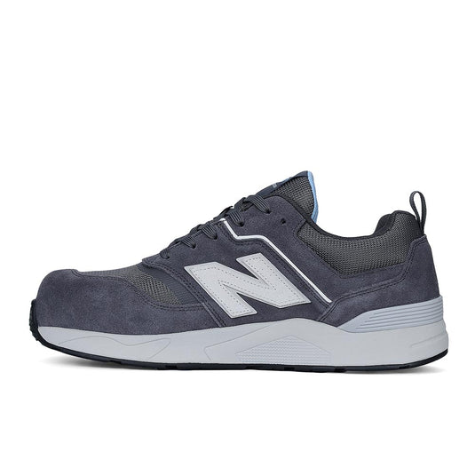 New Balance Elite Lite Womens Safety Shoe, Magnet/Whispy Blue, features a gray suede and mesh design with a white midsole, offering a composite safety toe and slip-resistant outsole for active workplace safety.