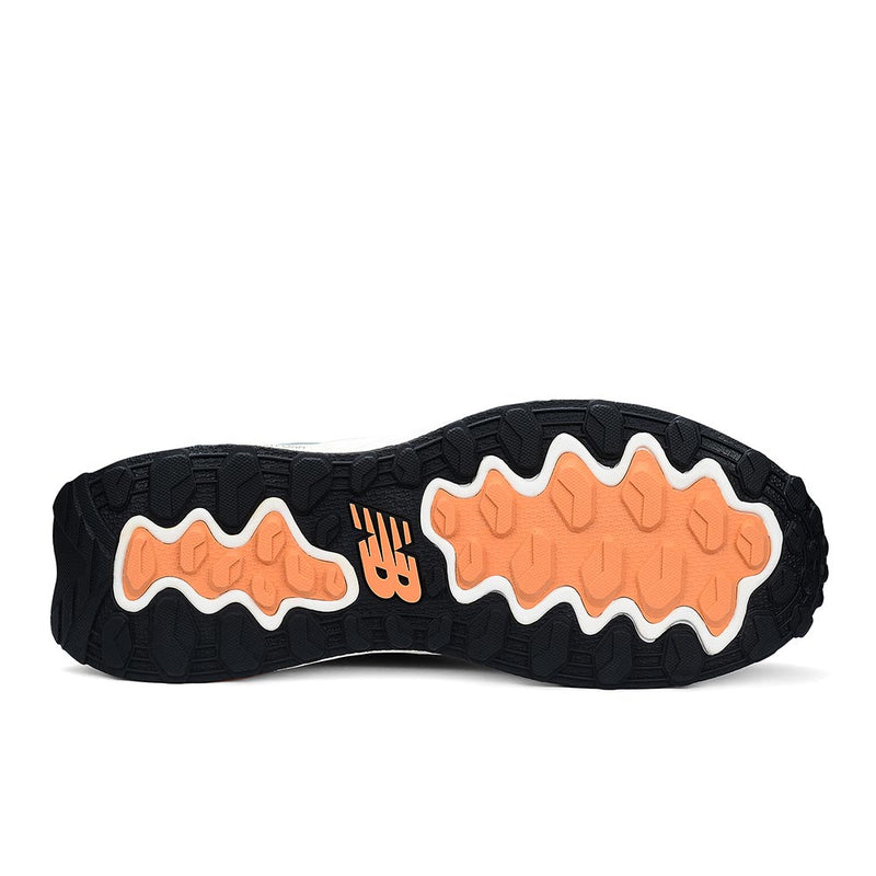 Load image into Gallery viewer, New Balance Fresh Foam Cremorne Women&#39;s Safety Shoe outsole displaying black rubber base with orange traction pods and NB logo, designed for slip-resistance and durability, ideal for workplace safety.

